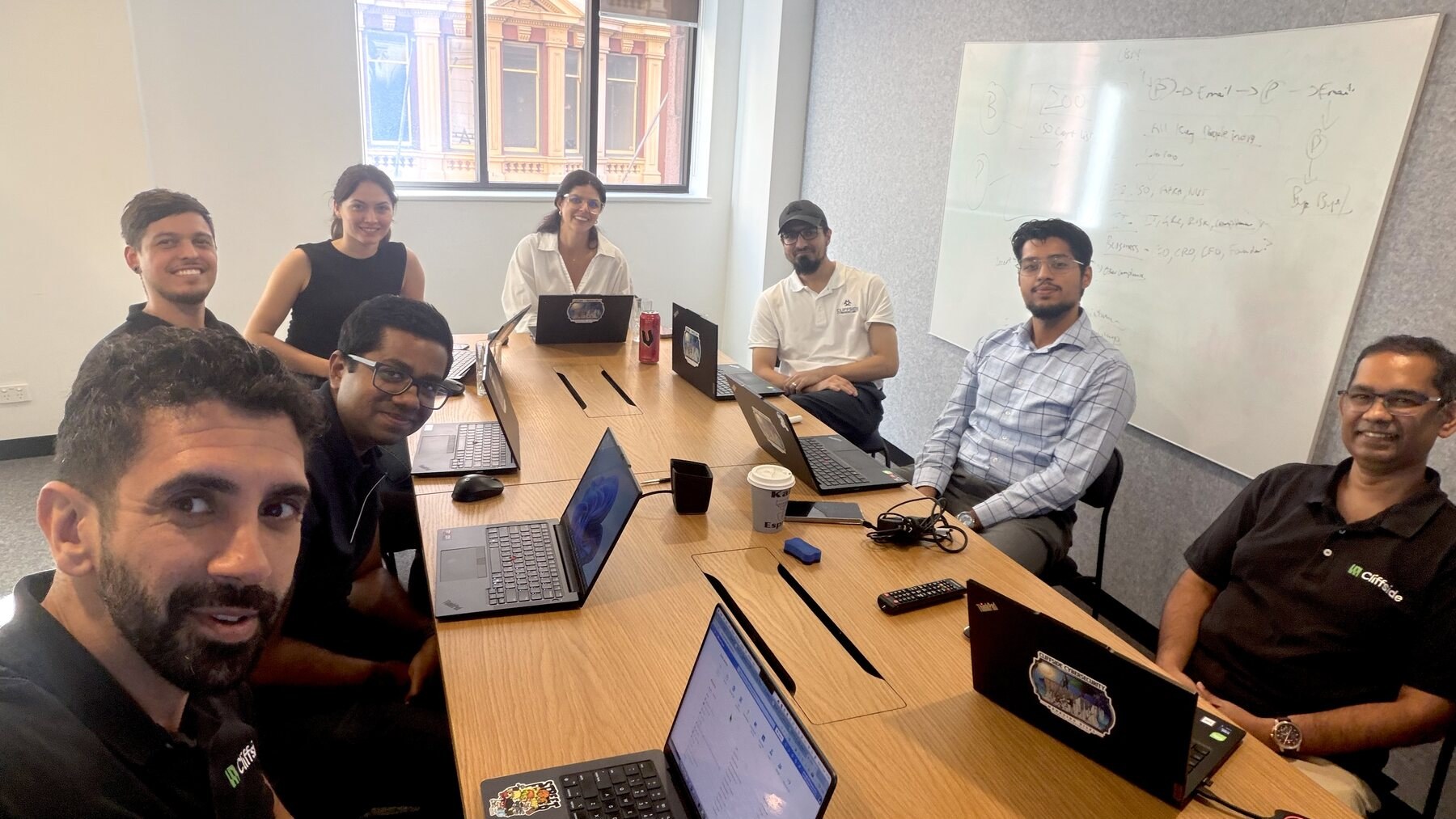 The Cliffside team, including placement students, working in the King Street meeting room